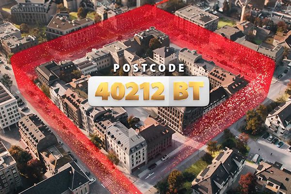 Aerial view of a city block highlighted with a red border, featuring the text "Postcode 40212 BT" in the center.